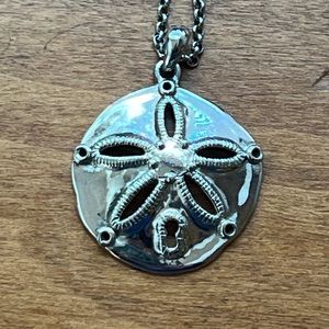 Cookie Lee silver sand dollar necklace on 16 in chain